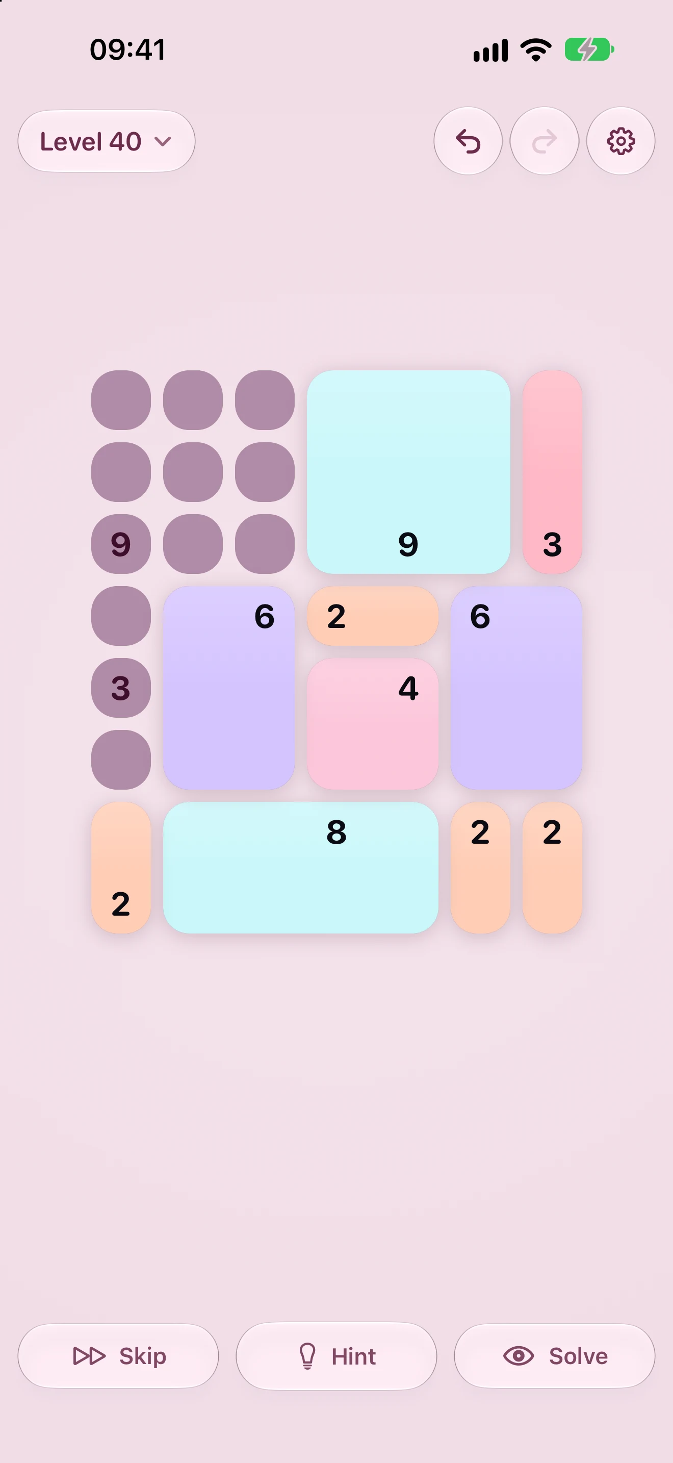 The same game in the Candy theme on a light background: pastel pieces on dusty mauve cells, showing one of the eight palettes.