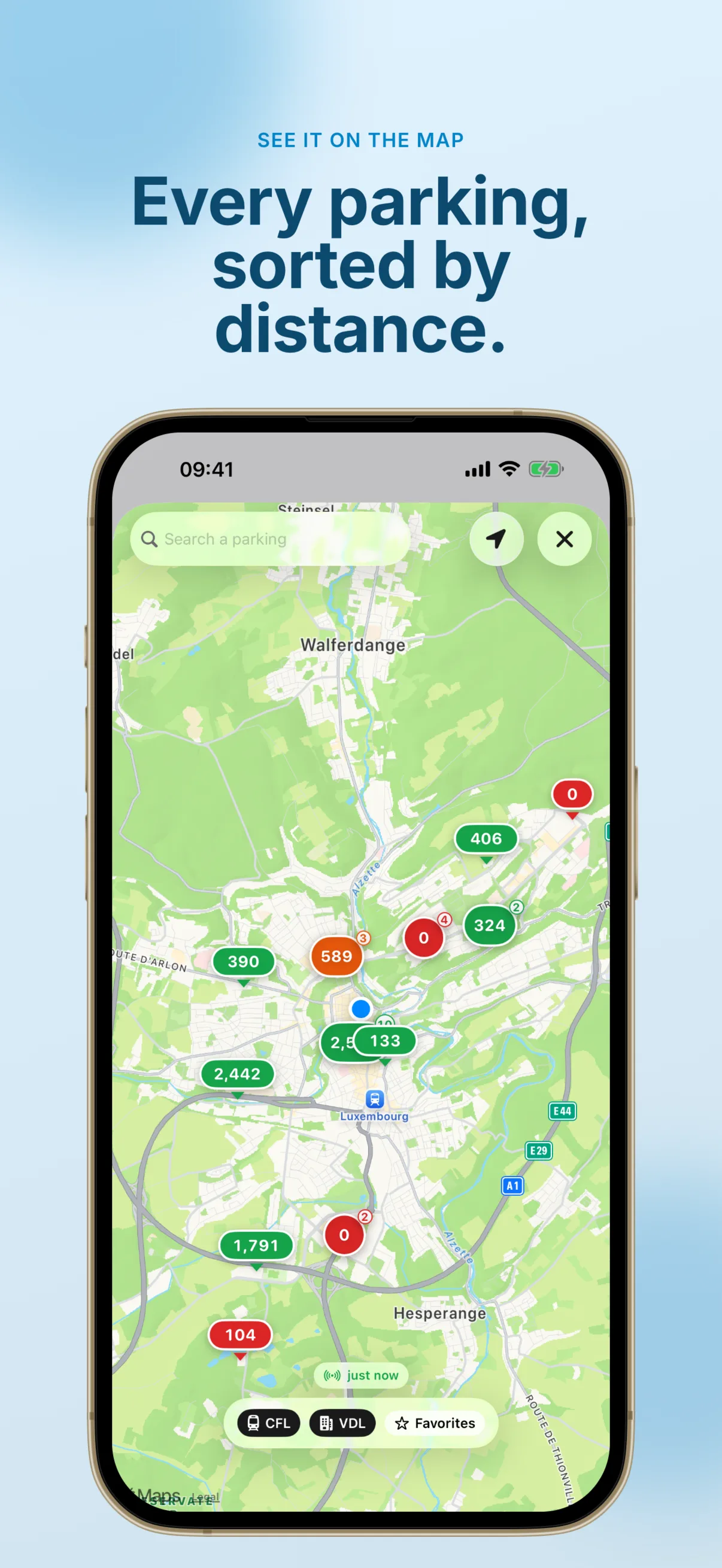 Full-screen map of the Luxembourg City area with colour-coded parking pins showing live free-space counts — green when plenty (406, 324, 390, 2,442), orange when filling (589) and red when full (0, 104) — a 'Search a parking' bar, the user's location dot, a 'just now' live indicator and CFL, VDL and Favorites filter chips.