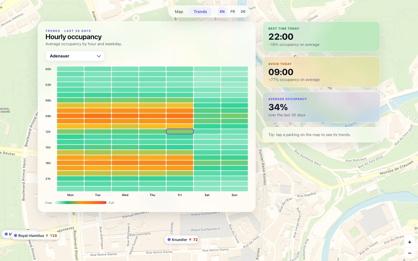 Trends view with a weekly occupancy heatmap and insight cards floating in frosted glass over the live map.